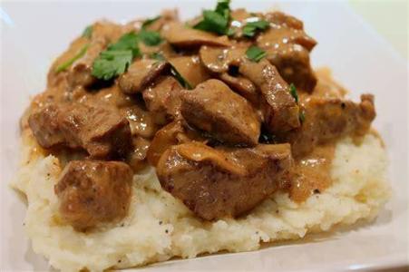 Beef Stroganoff?  “Beef stroganoff consists of strips of beef in a creamy sauce with mushrooms or tomatoes, often served with rice, noodles, or potatoes. This recipe has a long history, and many variations for its preparation exist.”