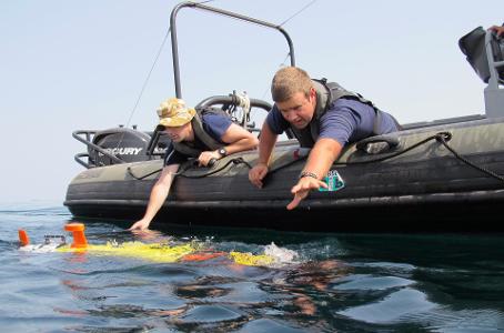 What is the recommended way to clean an inflatable boat?