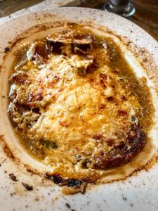 What is the traditional base of a French onion soup?