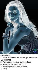 Stare at the red dot on this girls nose for 30 seconds then turn your eyes to a blank surface( like paper or ceiling) and blink repeatedly and quickly, what do you see?