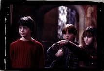 What was the name of the Hogwarts student who tried to stop Harry,Ron and Hermione from leaving the Gyffindor Common room to sneak to the 3rd floor corridor and try their hardest to stop the Philosophers Stone from being taken?