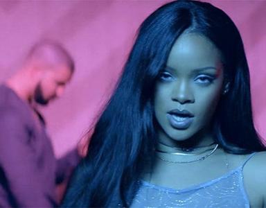 Which rapper starred alongside in Rihanna's song, "Work"?