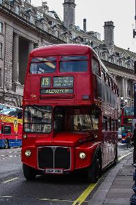 Which city is famous for its red double-decker buses and black cabs?