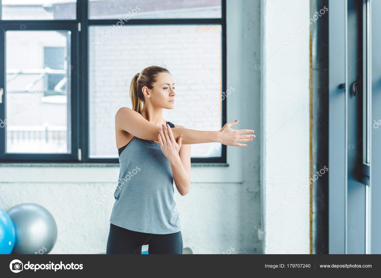 What is the purpose of warming up before exercising?