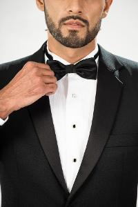Which type of tie is typically worn with a tuxedo?