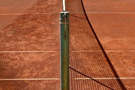 What is a common name for a tennis court divider net?