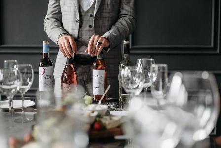 What is the purpose of a sommelier in fine dining?