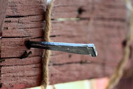 What tool was used to nail Jesus' hands to the cross?