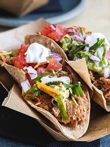 What type of cuisine is associated with tacos and quesadillas?