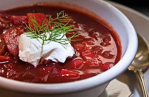 “Borscht is a sour soup commonly consumed in Eastern Europe and across Russia. The variety most often associated with the name in English is of Ukrainian origin, and includes beetroots as one of the main ingredients, which gives the dish its distinctive red color. It shares the name, however, with a wide selection of sour-tasting soups without beetroots, such as sorrel-based green borscht, rye-based white borscht and cabbage borscht.” Wikipedia.   Would you eat borscht?