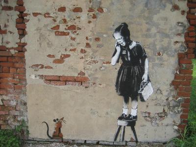 Who is the street artist behind the famous 'Girl with a Balloon' artwork?
