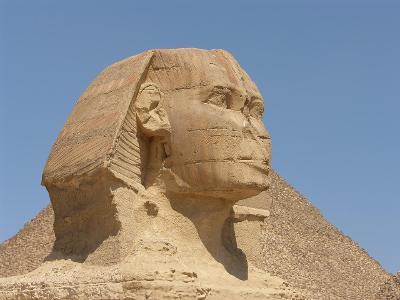 What is the Sphinx's riddle to travelers in Greek mythology?