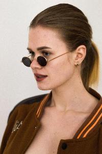 Which sunglasses shape is best suited for round faces?