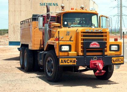 Which type of truck is commonly used for hauling large recreational vehicles and boats?