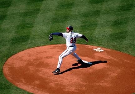 Which position is responsible for pitching the ball to the opposing team's batters?