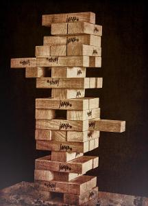 In the game Jenga, what are players asked to do?