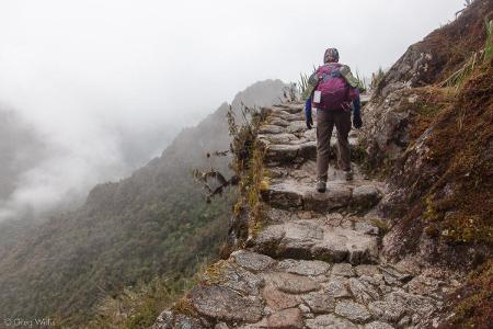 Which mountain range includes the popular hiking trail called the 'Inca Trail'?