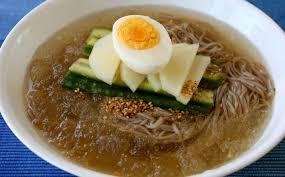 Naengmyeon or raengmyŏn is a Korean noodle dish of long and thin handmade noodles made from the flour and starch of various ingredients, including buckwheat, potatoes, sweet potatoes, arrowroot starch, and kudzu. Buckwheat predominates." Wikipedia.