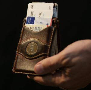 Which type of wallet is designed to be carried in a front pocket?