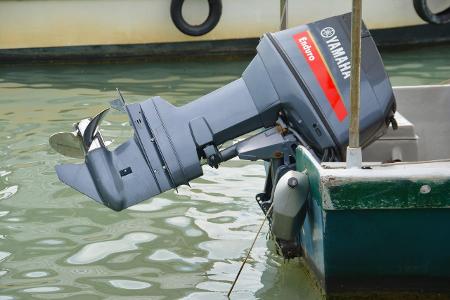 What is the purpose of an outboard motor on a boat?