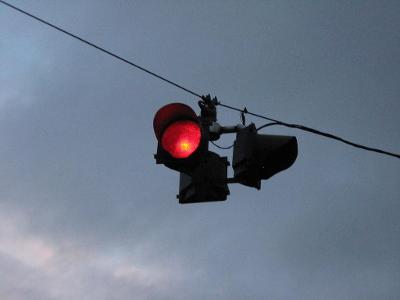 What does a flashing red traffic light mean?