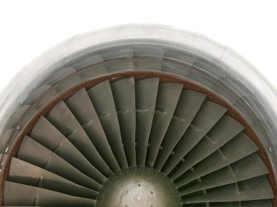 What is the primary function of a turbine in a jet engine?