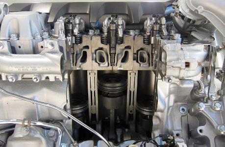 What is the purpose of a fuel injector in a truck engine?