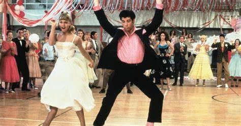 Name the type of Waltz performed in the musical movie Grease?