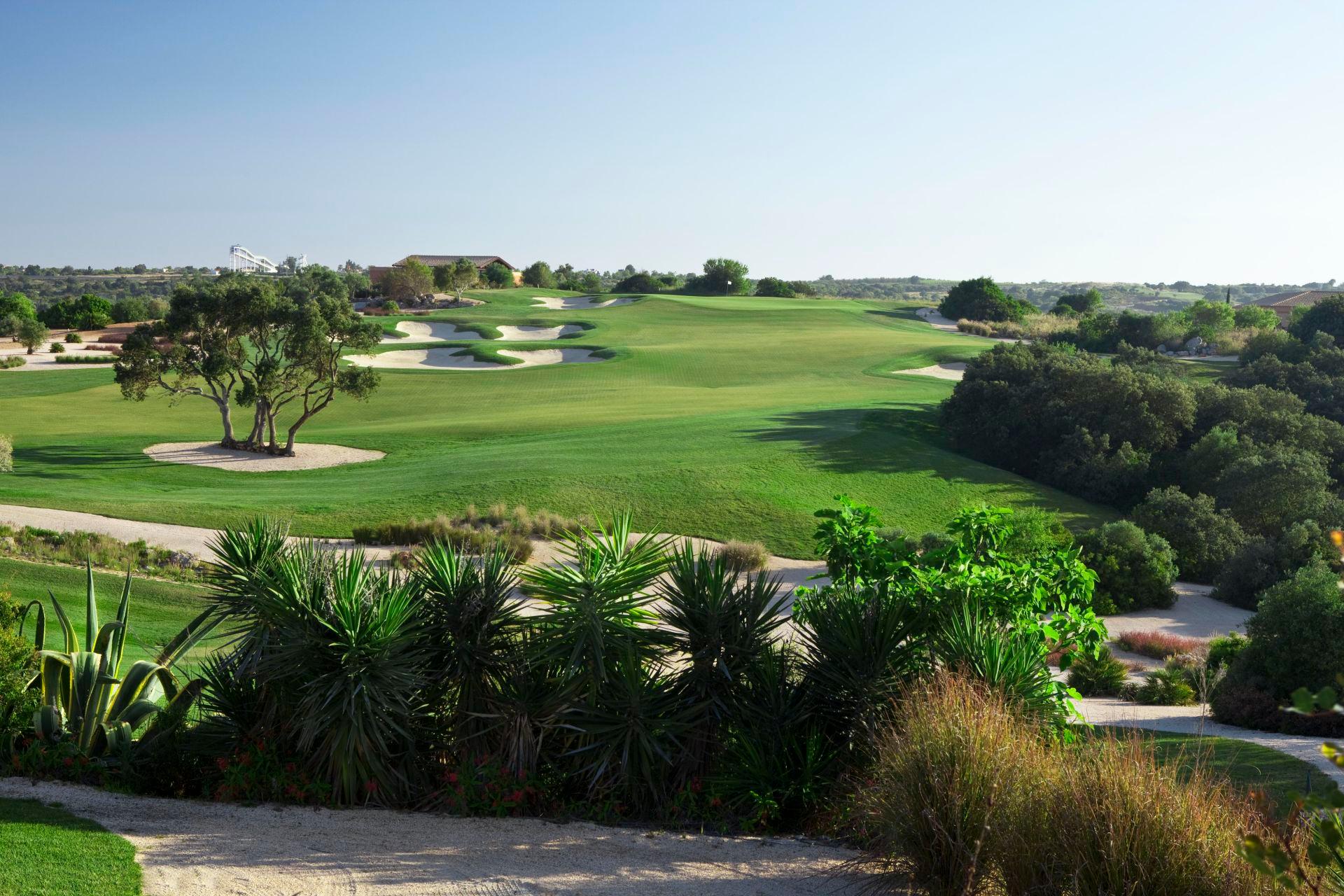 Which term is used to describe a hole that is played three strokes under par?