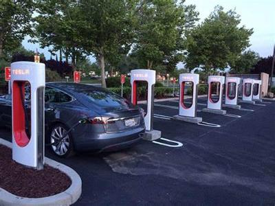 Which country was the first to host a Supercharger station outside of the US?