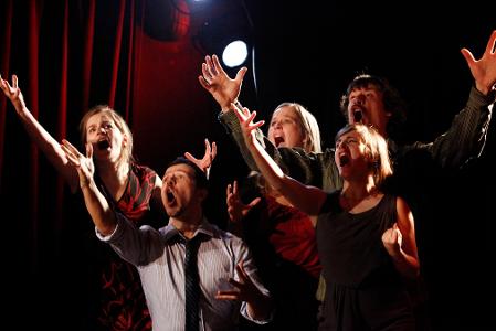 What is the purpose of improvisational theater?