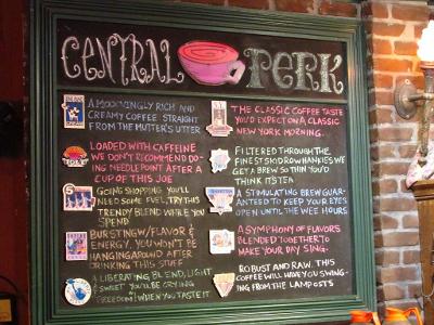 Which character is responsible for the Central Perk's 'Reserved' sign?