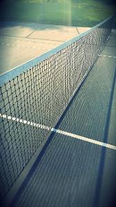 What is the name of the white line on the end of a regulation size tennis court?
