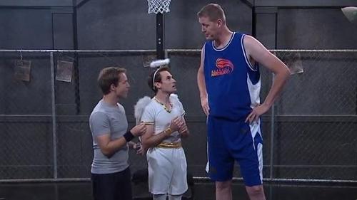 In one of the shoulder angel sketches, Matt climbs a 7' 6" man. What is his name?