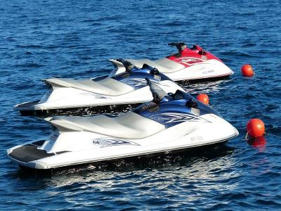 How many passengers can most jet skis accommodate?