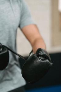 What type of gloves are often used in boxing?