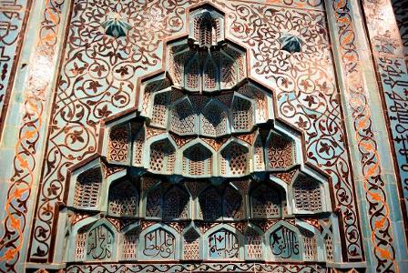 What is the primary purpose of a mihrab in a mosque?