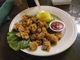 "Rocky Mountain oysters, also known as prairie oysters in Canada, also calf fries, is a dish made of cattle testicles. The organs are often deep-fried after being peeled, coated in flour, pepper and salt, and sometimes pounded flat."  Wikipedia
