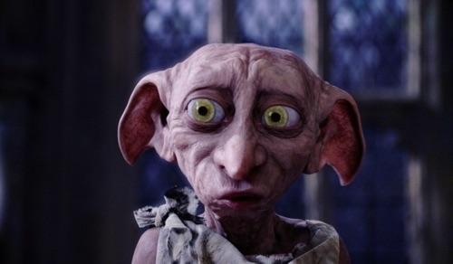 What house elf breaks into Harry's room in Chamber of Secrets?