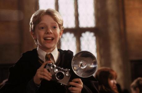 Which two students, out of these four, were petrified in The Chamber of Secrets book?
