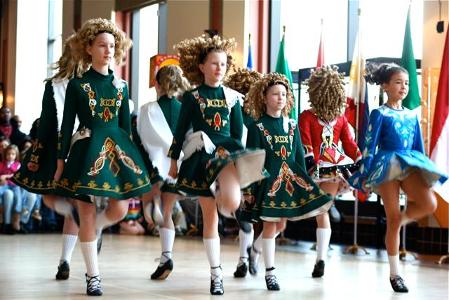 What is the term for the synchronized movement of a group of dancers in Irish step dance?