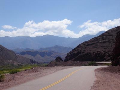 Which South American country offers challenging biking trails in the Andes Mountains?