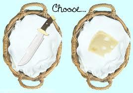 On a table there is a knife an a Block of cheese. A voice is telling you to choose, What do you do