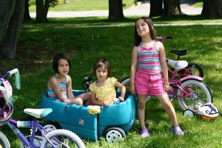 While in the park everyone gets tired of walking. The girls rented a little wagon so you can pull em in. You..