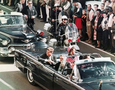 During the ambush that killed Kennedy, who else riding in the motorcade was wounded?