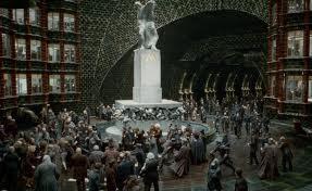 when harry Ron and hermione break into the ministry of magic which one of these ministry members now working for Voldemort chases them through the atrium hoping to catch them to hand them all over to Voldemort?