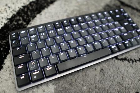 Which type of keyboard has keys that light up for better visibility in low-light environments?