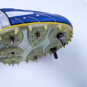 What is the purpose of rugby boots with studs?