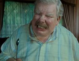 Vernon Dursley does his best to prevent Harry from getting his hands on his letters sent unknown to Harry from Hogwarts, when just sitting in the cupboard under the stairs Harry hears a noise, what does Harry see his uncle Vernon doing to prevent any letters getting in?