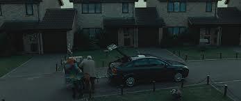 In Harry Potter and the Deathly Hallows Part 1 Harry watch as his family are packing the car getting ready to leave and go into hiding to stay safe in case Voldemort goes after them for information on Harry and his whereabouts, which member of the Dursley family comes up to Harry and shakes his hand before they go?